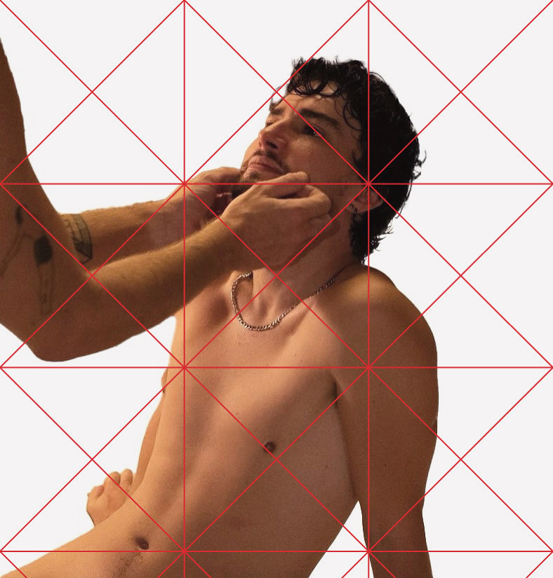 Source photograph for AWAITING INPUT by CHARACTERS — erotic image by Oli Raptor showing a nude figure on a bed, another subject's hands reaching to caress their face. Photographic basis for the ASCII translation. 2024.