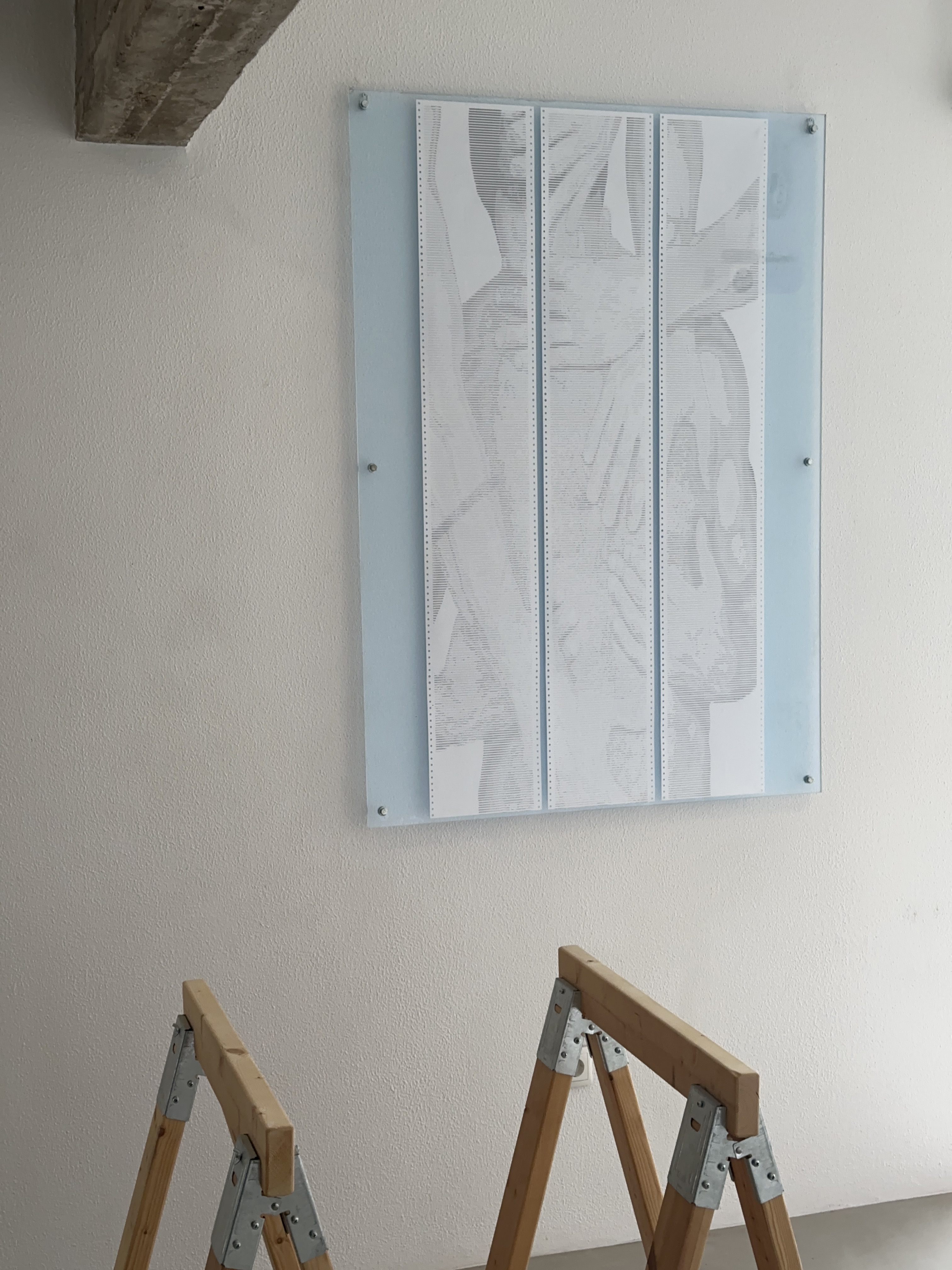 SOFT.RENDER by CHARACTERS shown with nearby objects for scale — three-sheet ASCII scroll, 72 × 140 cm, dot-matrix print on deadstock continuous-feed paper. 2025.